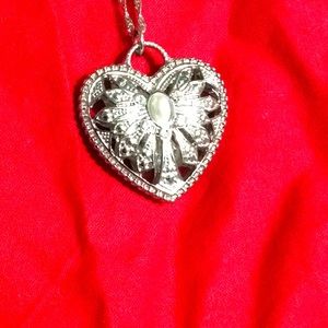 Sterling silver necklace with heart locket.